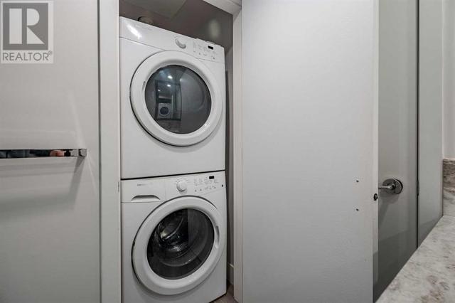 In suite laundry, stacked washer and dryer. EXTRA storage in parkade | Image 22