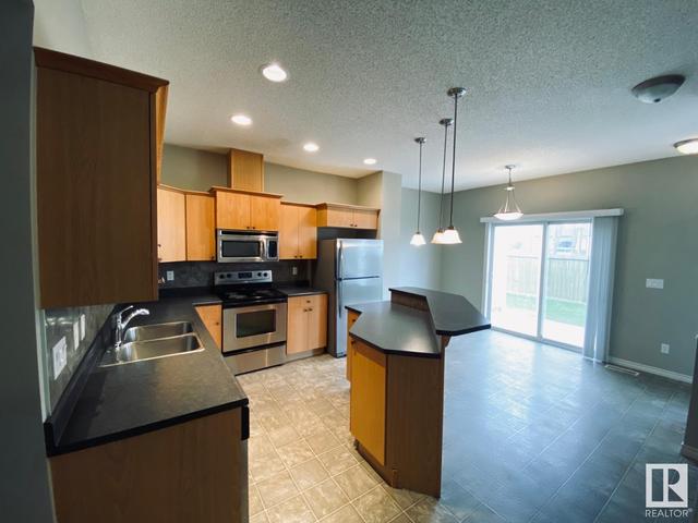 112 - 13825 155 Av Nw Nw, House attached with 2 bedrooms, 2 bathrooms and 2 parking in Edmonton AB | Image 4