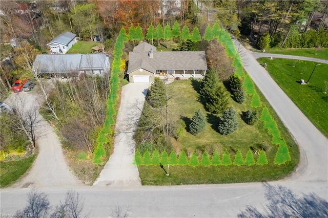 As if the property isn't already private enough, just imagine if you felt like planting a full perimeter of evergreens!  You'd be secluded for life :) Also take note of that 10 car driveway!  Wow. | Image 38