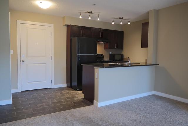 1407 - 403 Mackenzie Way Sw, Condo with 2 bedrooms, 2 bathrooms and 1 parking in Calgary AB | Image 2