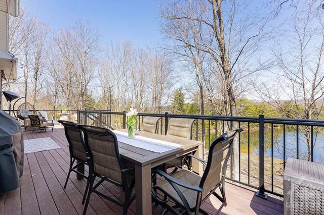 Deck offers outside dining with propane hookup for BBQ. Deck also has rough-in for hot tub. | Image 18