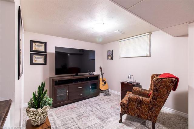Large family room to enjoy some free time or a place to watch hockey or baseball. Or read a good book. | Image 4