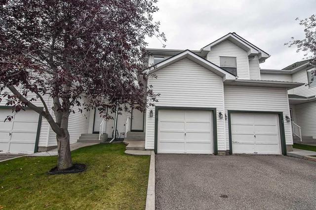5 Sandpiper Link Nw, Home with 3 bedrooms, 1 bathrooms and 2 parking in Calgary AB | Image 1