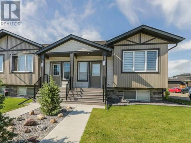 335 Spruce Street, House attached with 3 bedrooms, 2 bathrooms and 1 parking in Red Deer County AB | Card Image