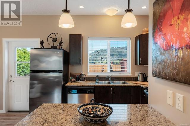 Kitchen has mountain views and is complete with granite countertops and stainless steel appliances. | Image 10