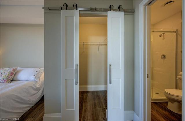 split barn-style doors to walk-in closet | Image 8