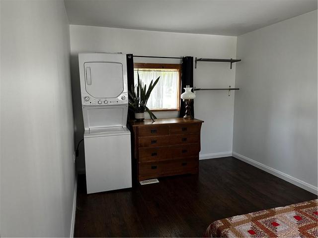 Bedroom with convenient laundry facilities without walking to laundry mat. | Image 14