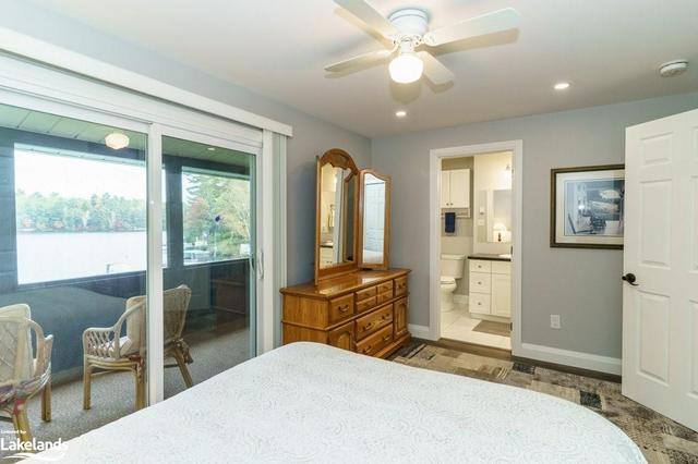 Wake up to stunning lake views in the Primary Bedroom with large closet and 3 piece ensuite bathroom. | Image 27