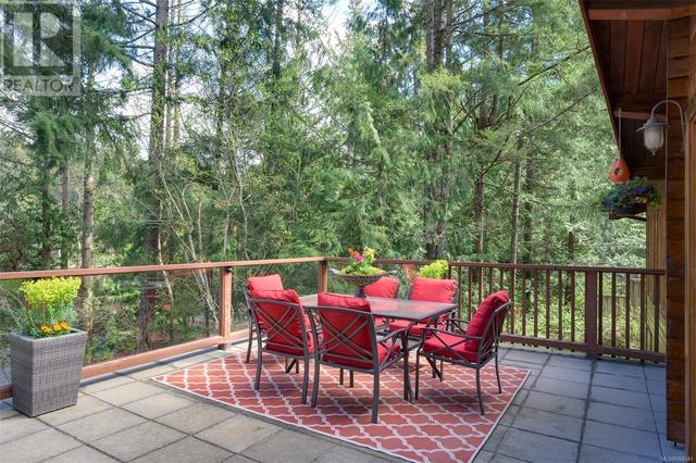 Lots of room on the deck for outside dining in a private treed setting | Image 21