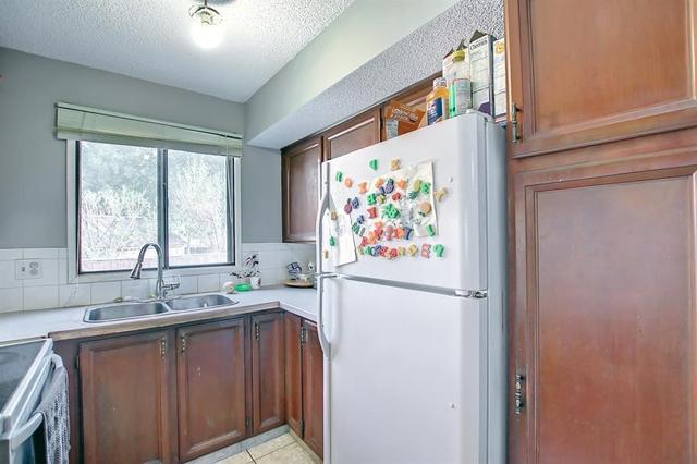 22 Ranchlands Place Nw, House attached with 3 bedrooms, 1 bathrooms and 2 parking in Calgary AB | Card Image