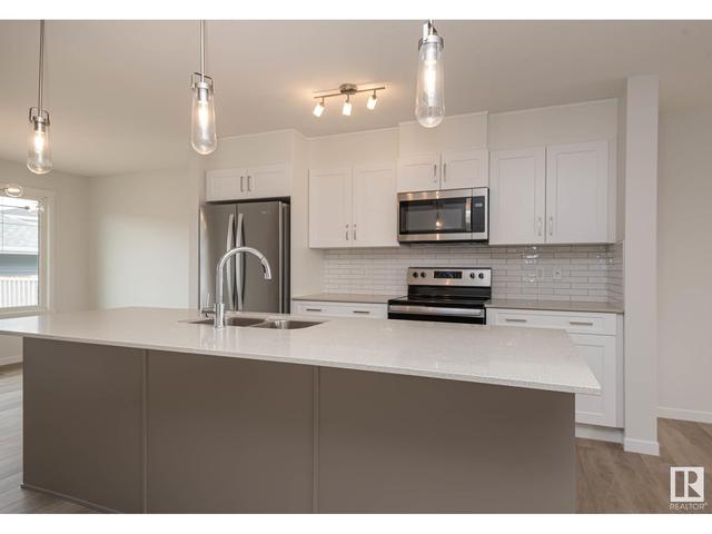 5702 Juchli Av Nw, House attached with 3 bedrooms, 3 bathrooms and null parking in Edmonton AB | Image 6
