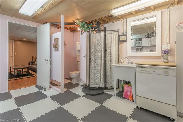 Laundry room features a 1 pc. water closet; could be expanded to make a full bathroom. | Image 22