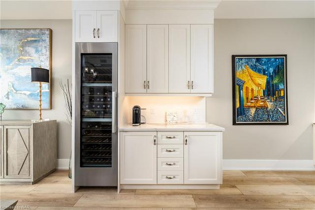 Enns built in bar area with additional storage and a Miele temperature controlled win/beverage refrigerator | Image 6