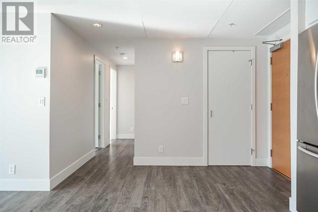 Wide entree with door to insuite laundry and storage. Also, more storage in the parkade! | Image 12