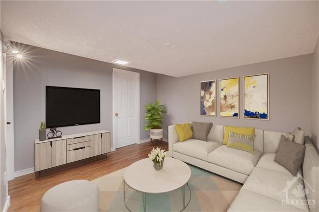 The recreation room in the lower level brings extra space for any growing family (virtually staged photo) | Image 23