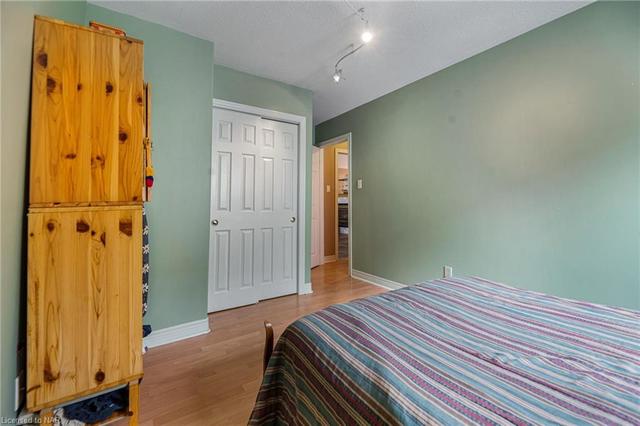 Lower level primary bedroom with walk in closet | Image 17