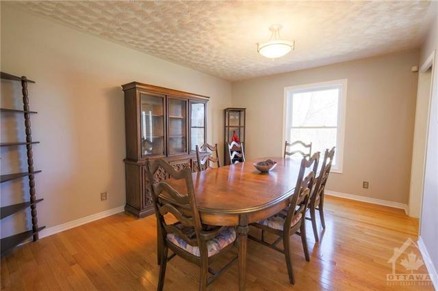 The large formal dinning room off the kitchen is the perfect place for entertaining | Image 9
