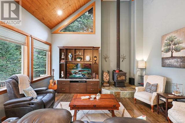 Vaulted ceilings with cozy wood fireplace, lots of natural light | Image 3