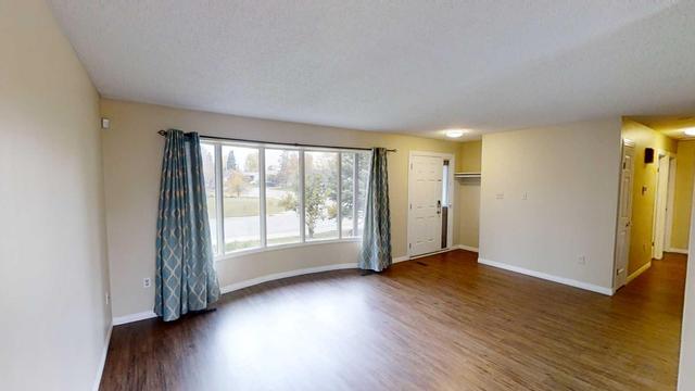 9813 73 Avenue, Home with 4 bedrooms, 2 bathrooms and null parking in Grande Prairie AB | Image 2