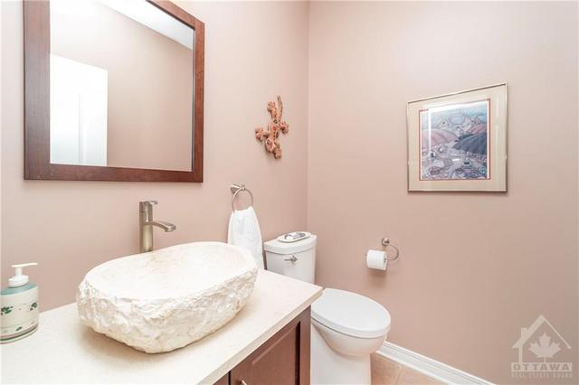 Beautifully updated powder room on the main level. | Image 13