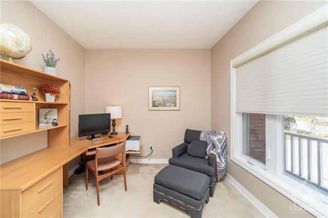 Main floor den (or possibly a 5th bedroom) is ideal for those working from home! | Image 18