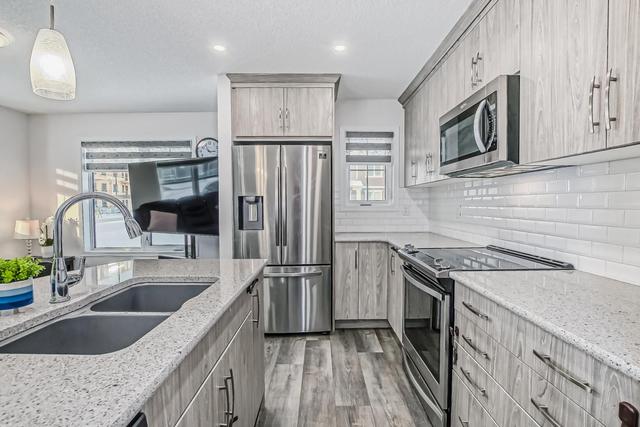 268 Carrington Way Nw, Home with 3 bedrooms, 2 bathrooms and 2 parking in Calgary AB | Image 6