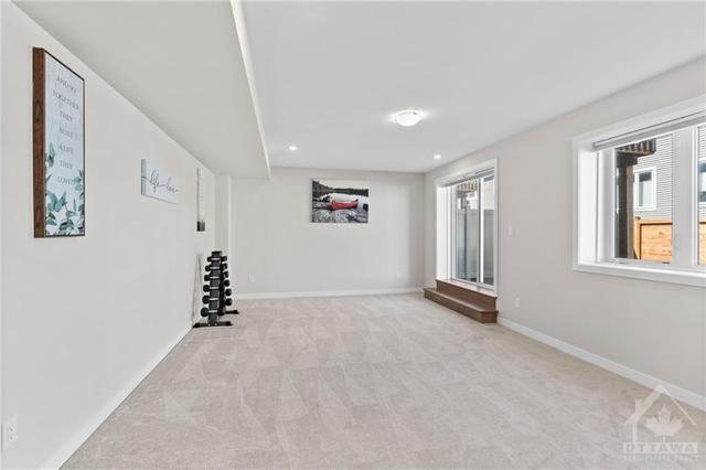 Lower Level Walk-Out- Expansive Recreation room w/ sliding door walkout to back yard. | Image 28