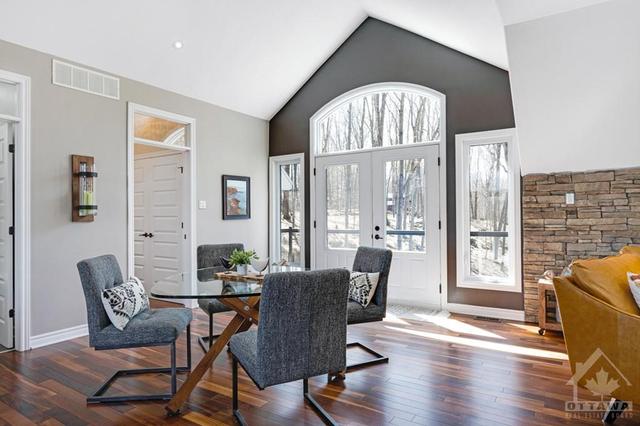 Dine by another amazing arched window and glass doors opening to front balcony | Image 9