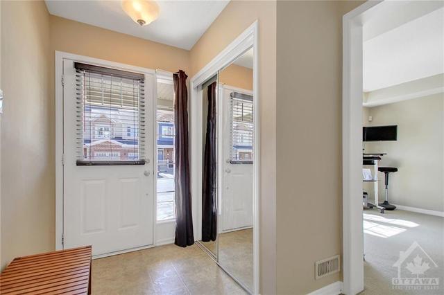 Enter into the home to the spacious tiled Foyer. | Image 3