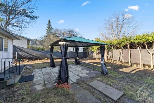 gazebo in yard | Image 13