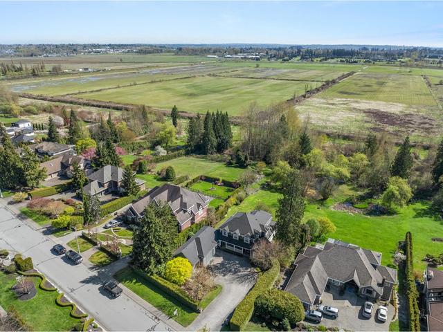 16438 77 Avenue, House detached with 6 bedrooms, 5 bathrooms and 14 parking in Surrey BC | Image 3