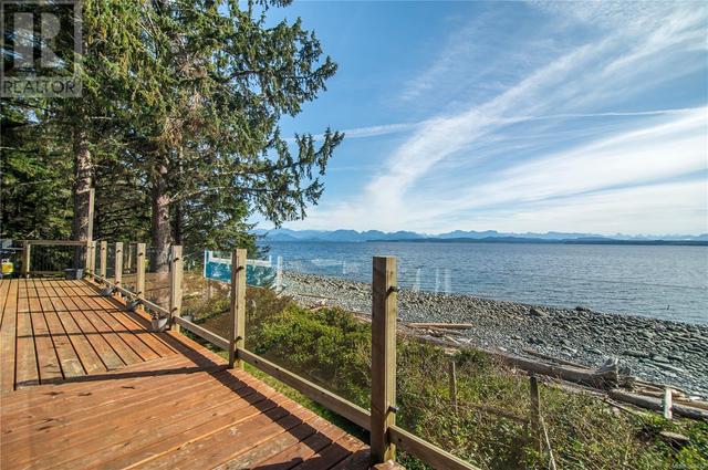 large deck with water view | Image 29
