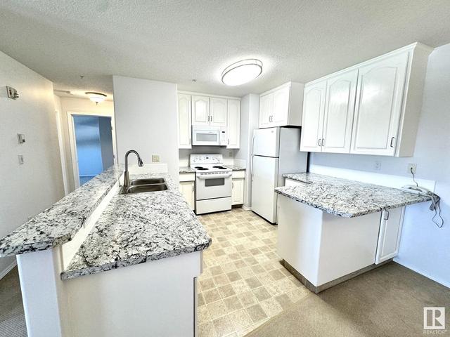 206 - 4604 48a St, Condo with 2 bedrooms, 1 bathrooms and null parking in Leduc AB | Image 19