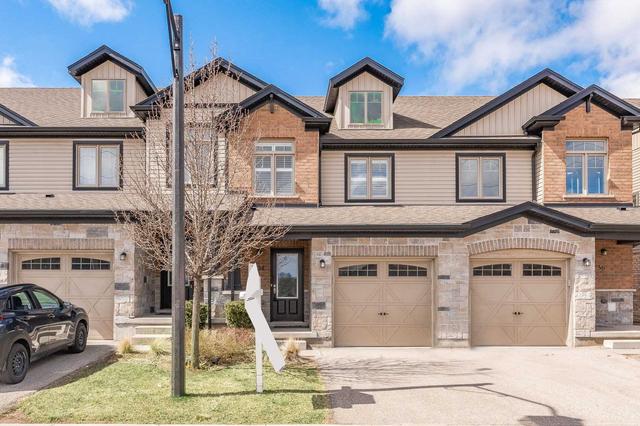 34 Arlington Cres, Townhouse with 3 bedrooms, 3 bathrooms and 2 parking in Guelph ON | Image 1