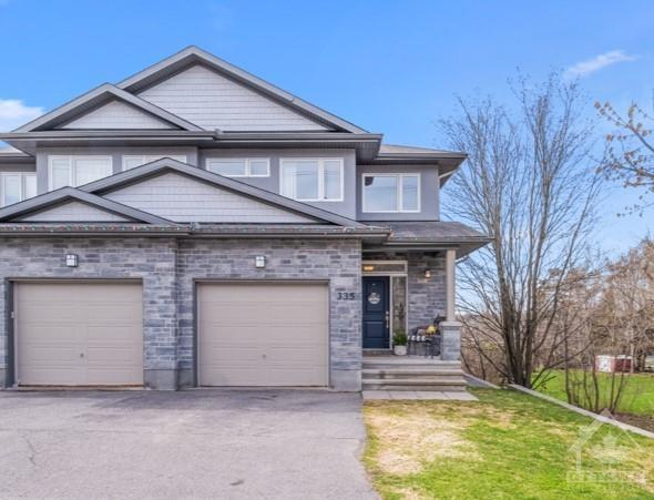 335 Donald B Munro Drive, Home with 3 bedrooms, 4 bathrooms and 3 parking in Ottawa ON | Image 1