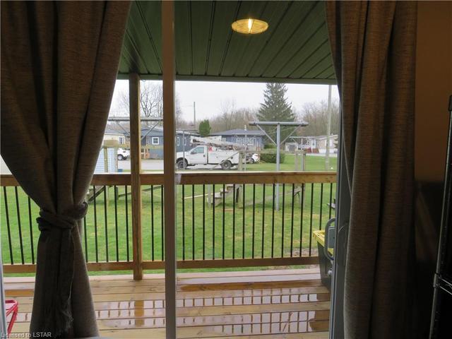 view of common area with clothes lines and green space | Image 16