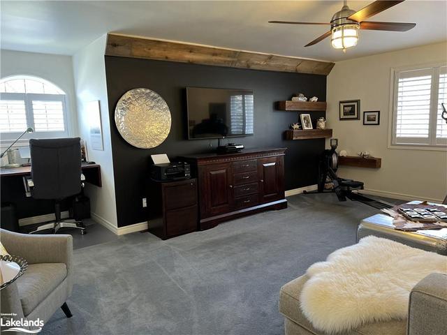 upper family room with built in desk area | Image 6