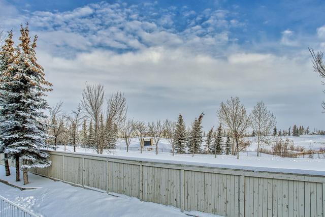 80 Crystal Shores Cove, Home with 3 bedrooms, 2 bathrooms and 2 parking in Calgary AB | Image 49