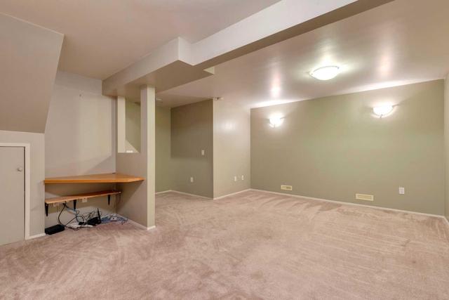 Basement Media Room with Built-in Office Space | Image 16