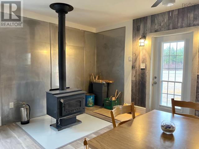 WOOD STOVE APARTMENT ENTRY | Image 6