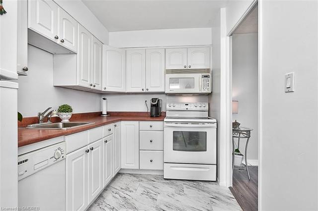 Kitchen with White Cabinetry | Image 13