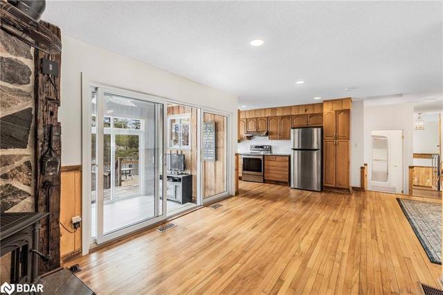 Living Room with walk out to Sunroom and Deck | Image 14