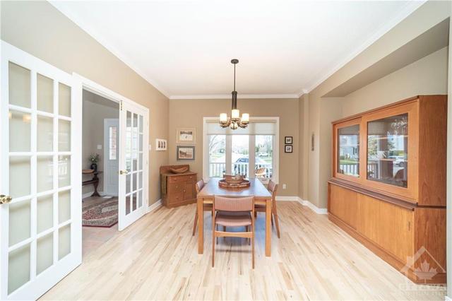French doors lead from the entrance into the dining and kitchen areas. | Image 3