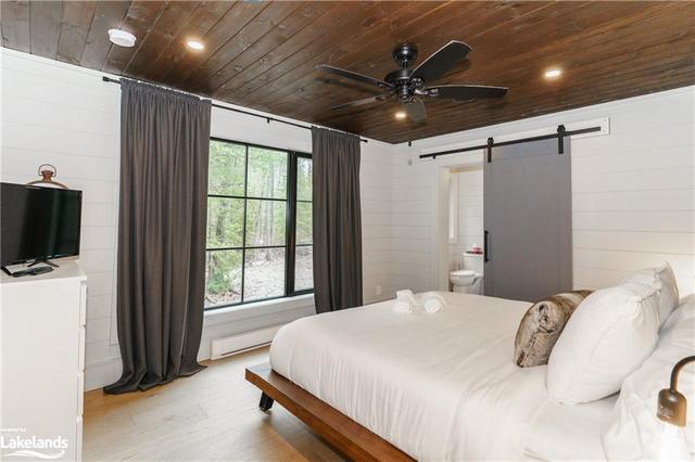 Your King size bed is in the quietest part of the cottage and has a cute ensuite with large shower finished with Italian tile. | Image 28