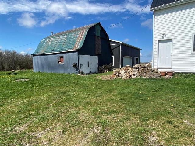 The rustic barn and garage is in background. | Image 33