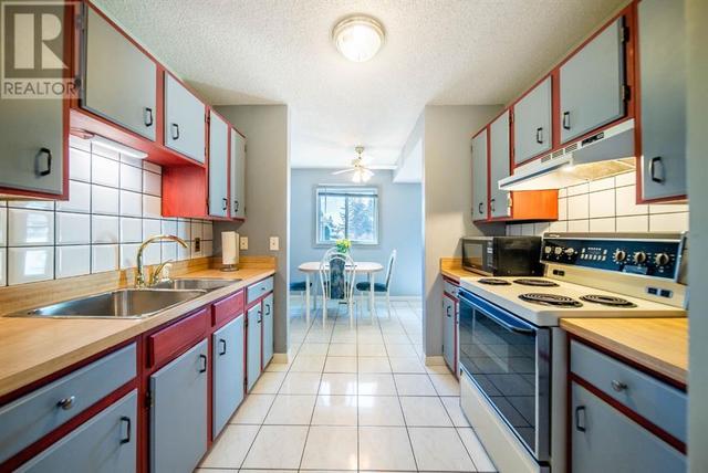 70, - 14736 Deerfield Drive Se, House attached with 2 bedrooms, 1 bathrooms and 2 parking in Calgary AB | Image 11
