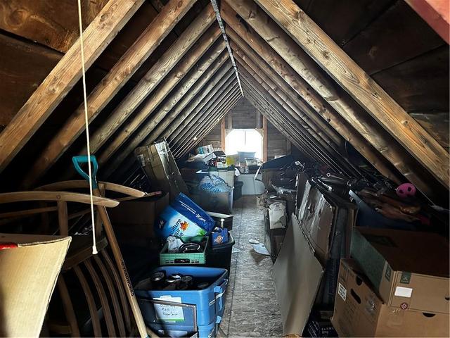 Loft above with potential and/or storage.  Hot water tank located to left of door. | Image 19