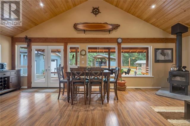 the home offers a beautiful Westcoast design & vaulted wood ceilings, French doors to back covered deck | Image 19