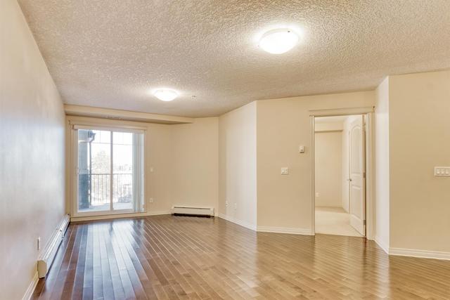 2212 - 175 Panatella Hill Nw, Condo with 2 bedrooms, 2 bathrooms and 1 parking in Calgary AB | Image 2