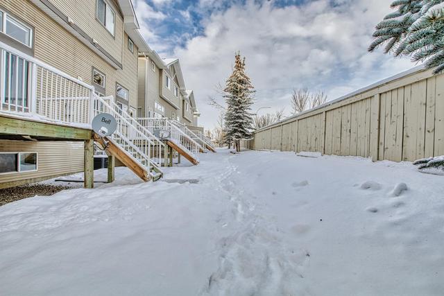 80 Crystal Shores Cove, Home with 3 bedrooms, 2 bathrooms and 2 parking in Calgary AB | Image 46